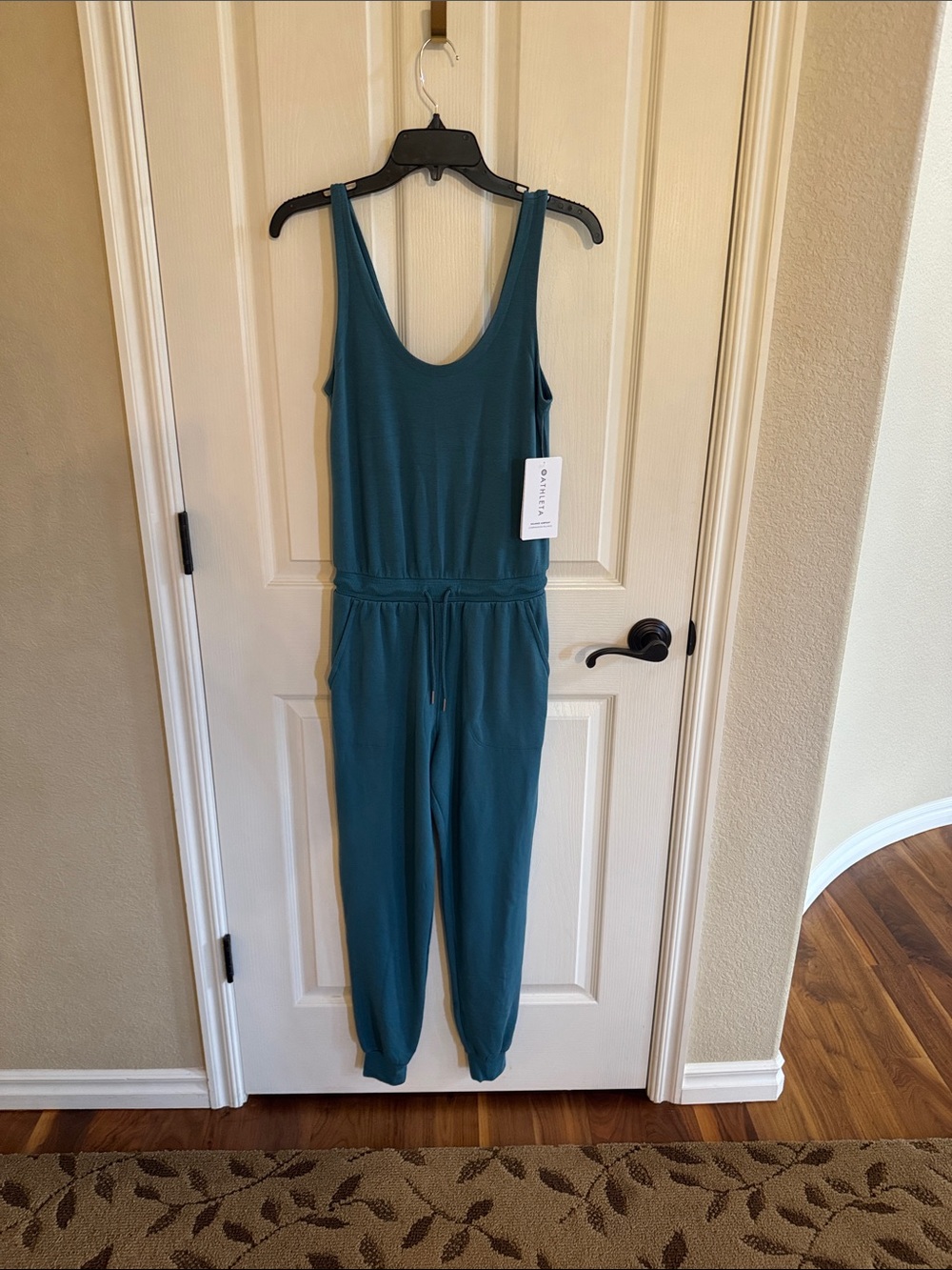 NWT Athleta Balance Jumpsuit. Turquoise color size XXS.